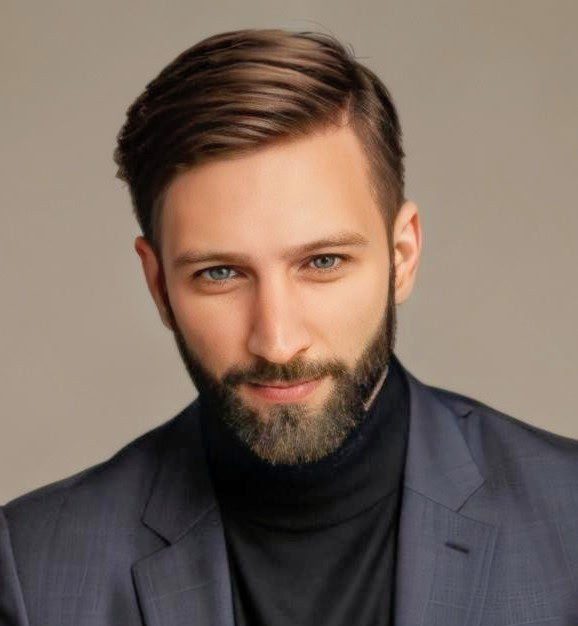 Image20250501101413crop A man with beard and suit jacket on